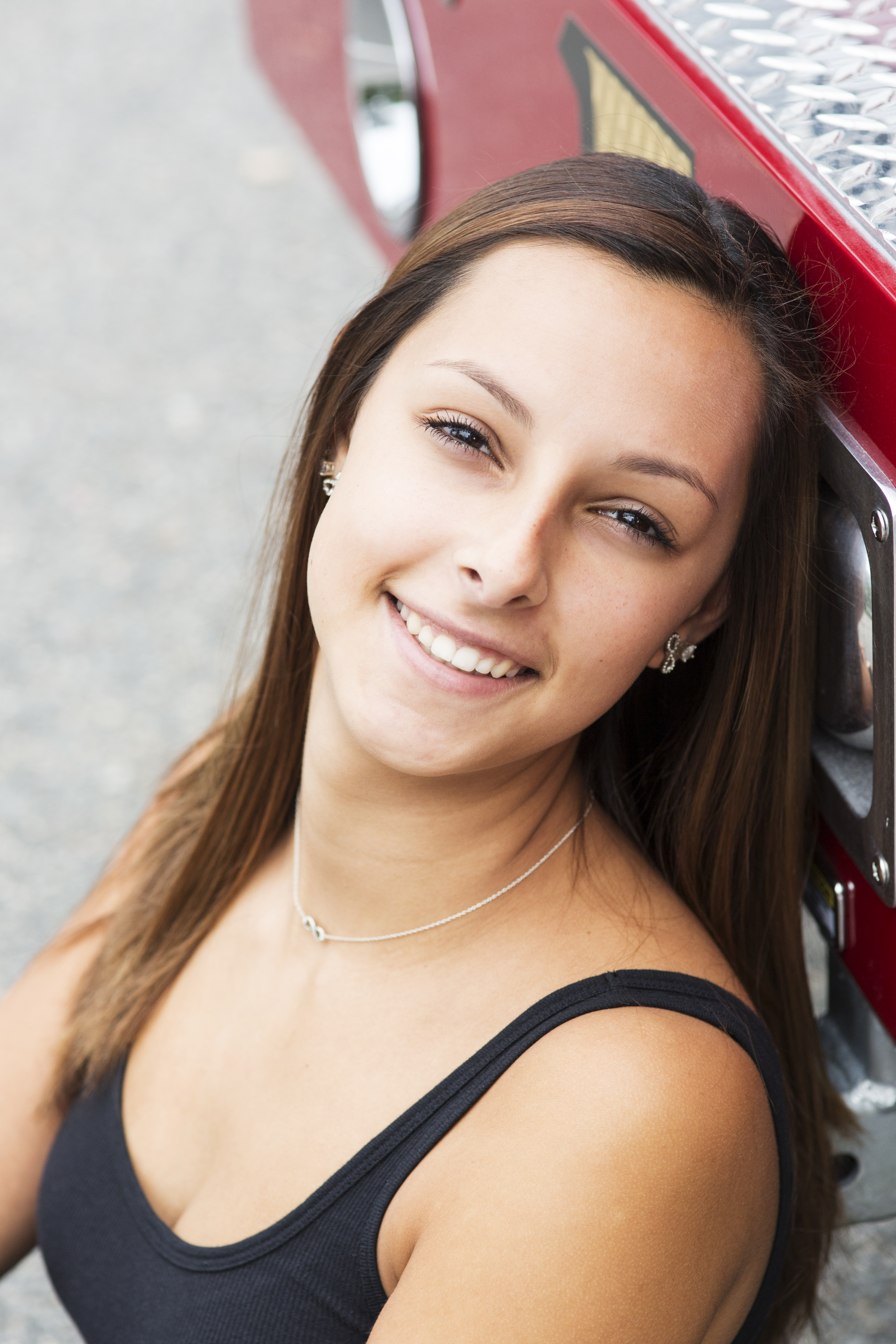 beautiful senior portrait headshot outdoors brown haired girl