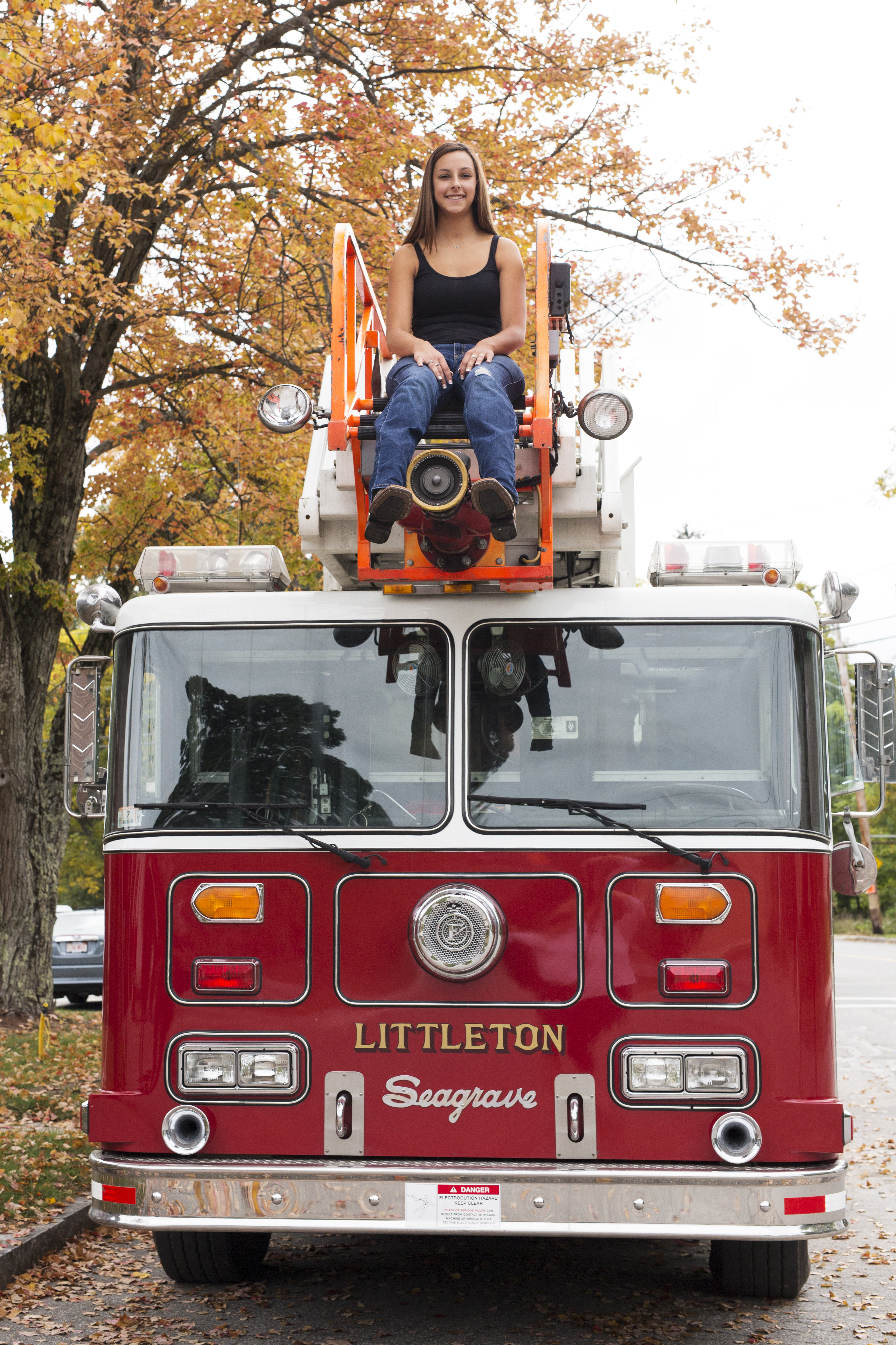 senior photo girl new england fall leaves fire truck