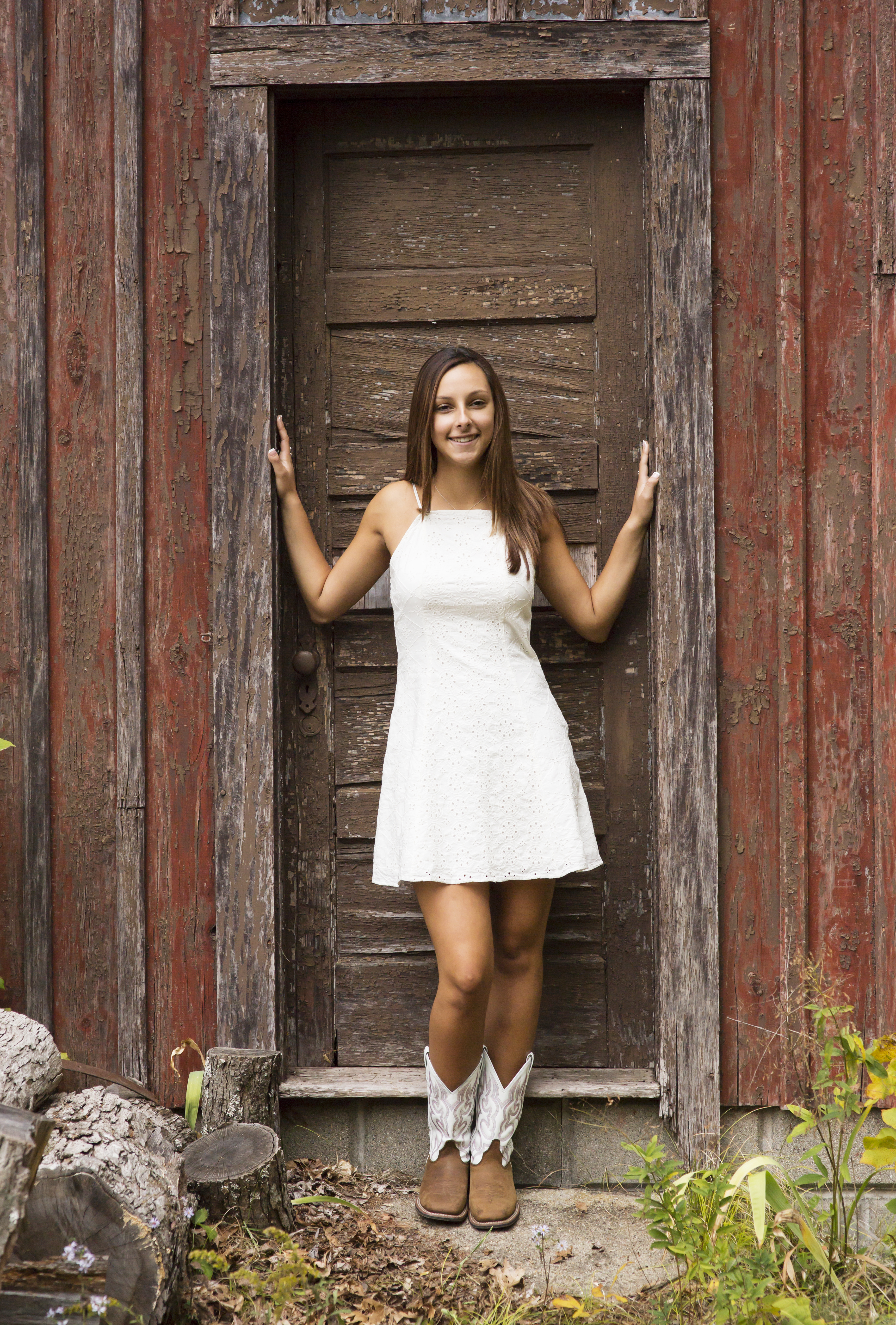 rustic barn senior portrait girl in white dress and boots