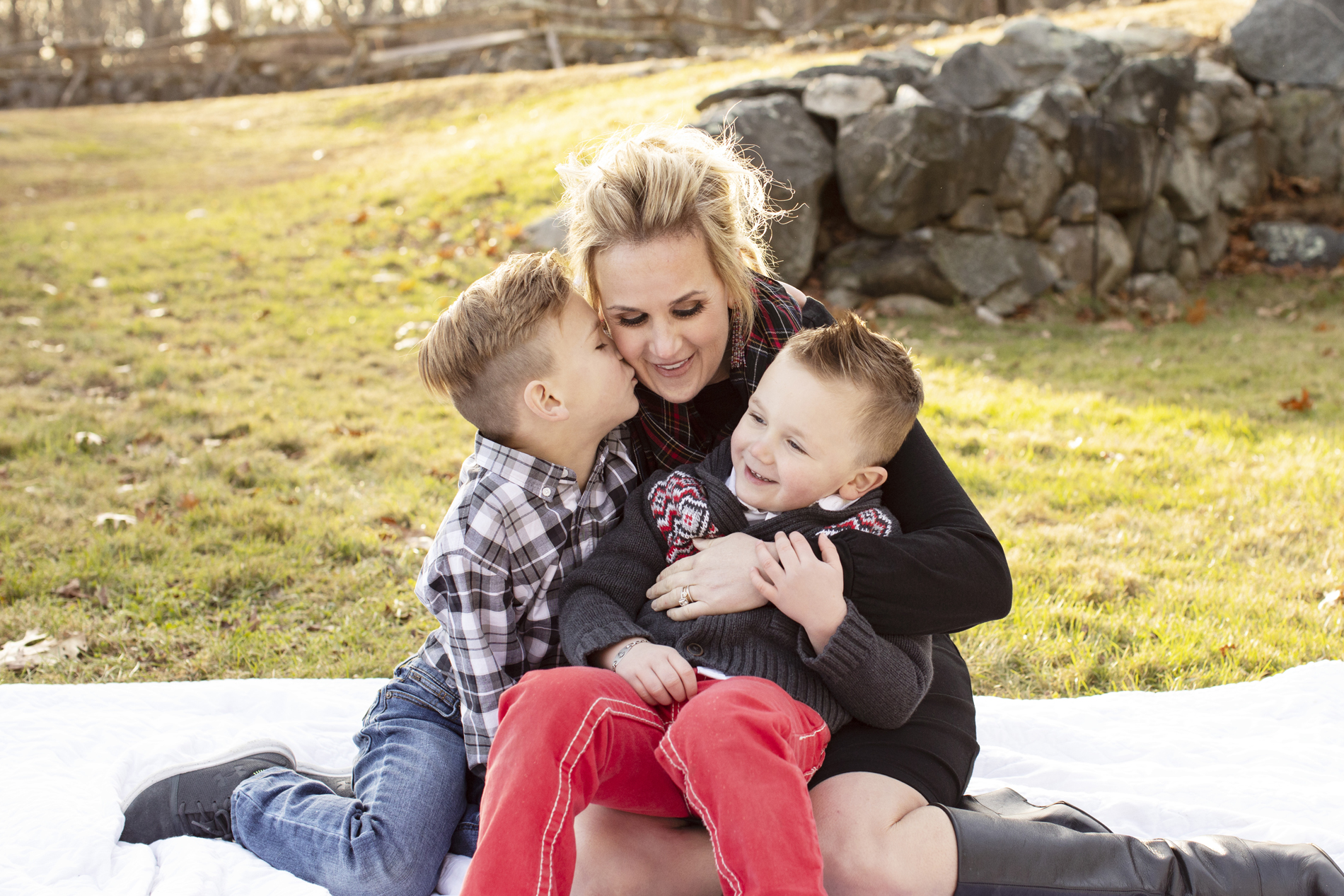 mom sitting on blanket with two boys battle road concord lexington lincoln massachusetts